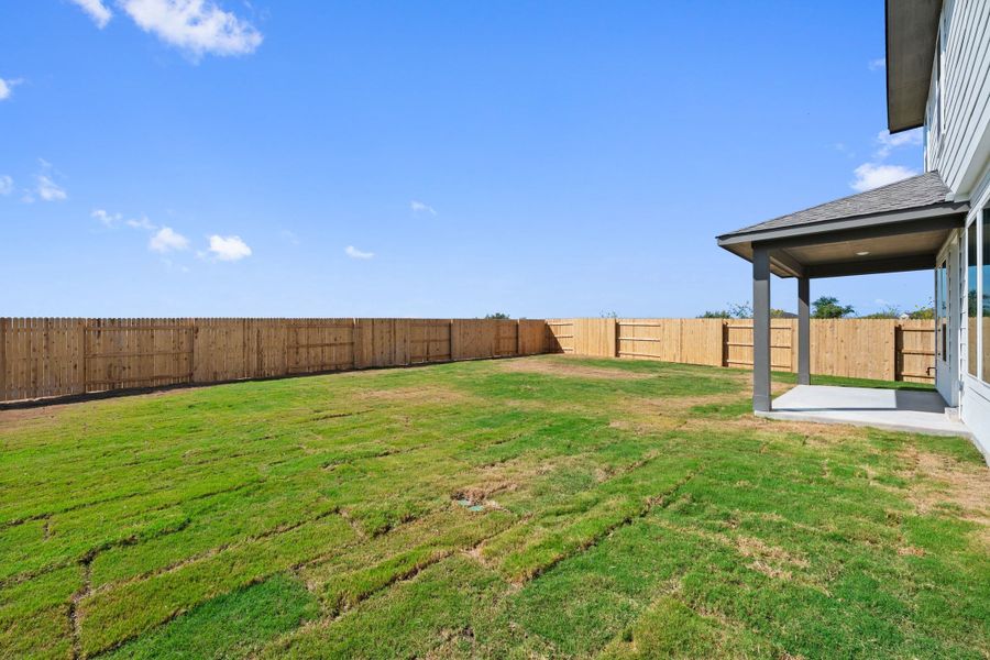 Exterior details and patio area of a home in Terrace Collection At Turner's Crossing, Buda (Image 4).