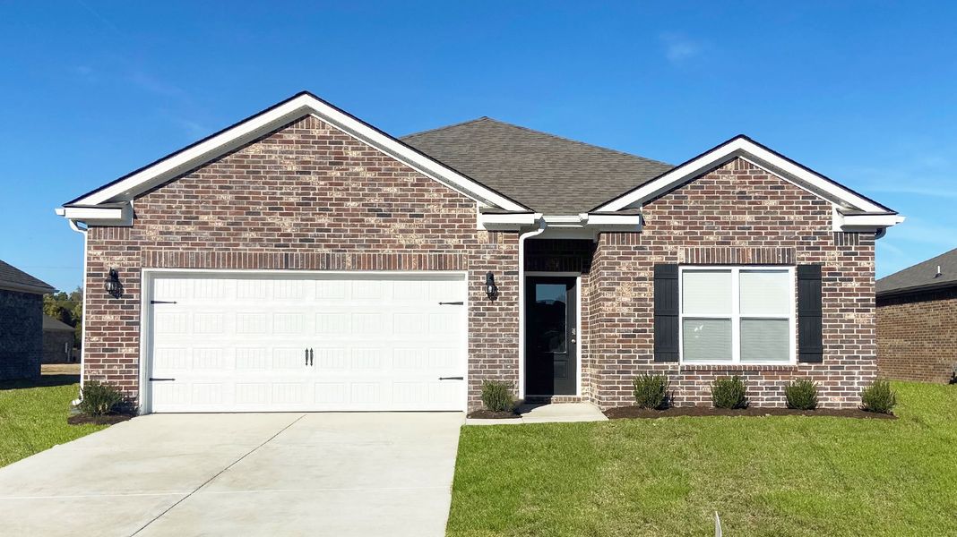 Front exterior of a new home in Riggs Pointe, Millington, TN, highlighting curb appeal (Image 1). Front exterior of a new home in Riggs Pointe, Millington, TN, highlighting curb appeal (Image 1).