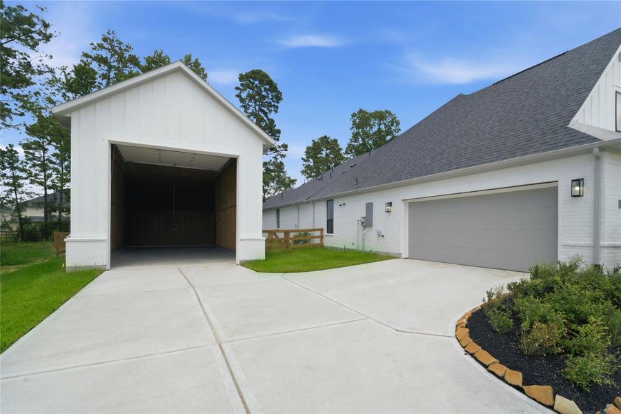 Front exterior of a new home in Timber Hollow, Magnolia, TX, highlighting curb appeal (Image 2). Front exterior of a new home in Timber Hollow, Magnolia, TX, highlighting curb appeal (Image 2).