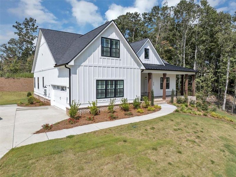 Front exterior of a new home in , Ball Ground, GA, highlighting curb appeal (Image 19).