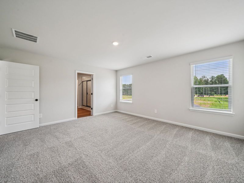 Spacious, unfurnished interior of a new home in Vines at Mill Creek - Estate Series, Braselton (Image 16).