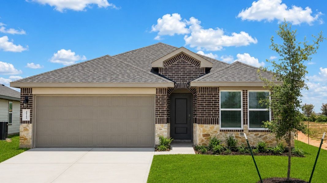 Front exterior of a new home in Tamarron, Fulshear, TX, highlighting curb appeal (Image 1). Front exterior of a new home in Tamarron, Fulshear, TX, highlighting curb appeal (Image 1).