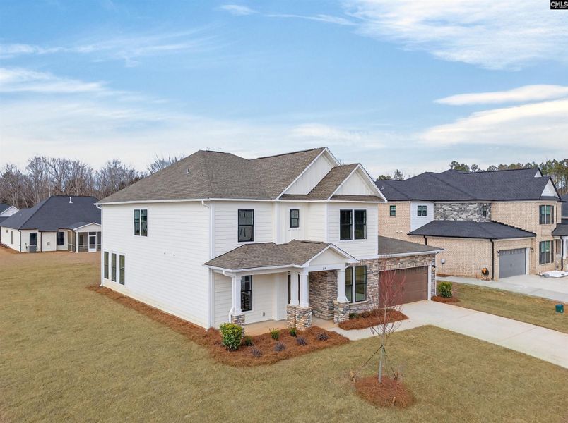 Front exterior of a new home in Collins Cove, Chapin, SC, highlighting curb appeal (Image 30).