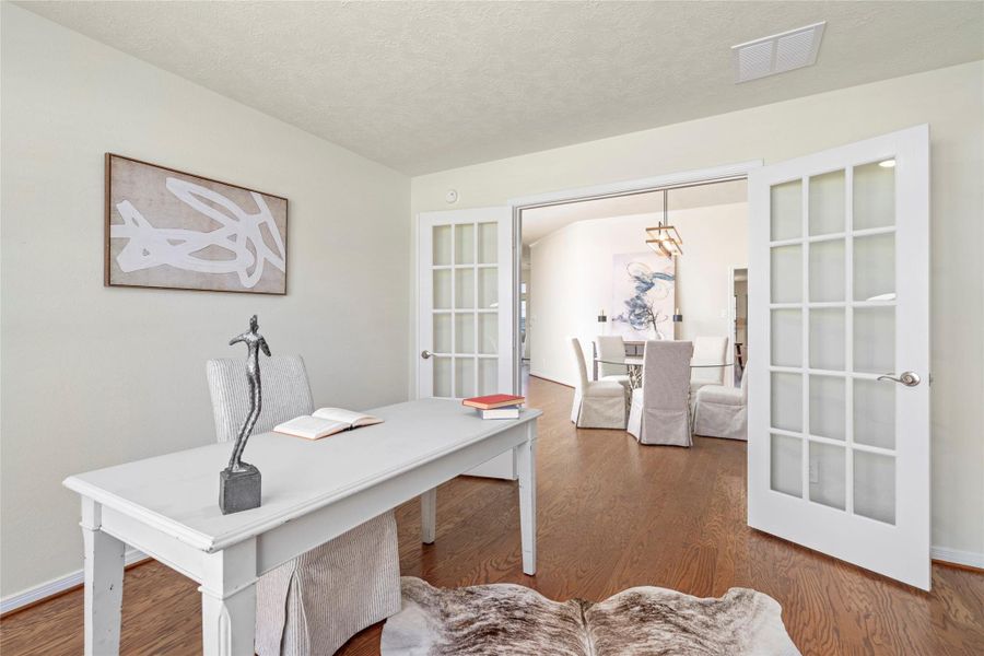 The french doors in the study bring more light to the dining room and privacy to the space. The french doors in the study bring more light to the dining room and privacy to the space.