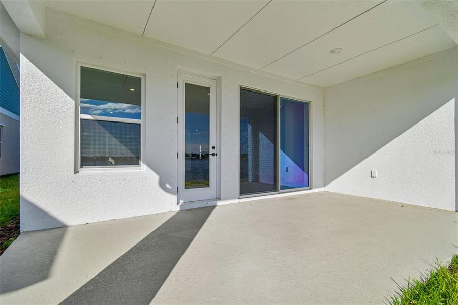 Exterior details and patio area of a home in The Peninsula at Rhodine Lake, Riverview (Image 25).