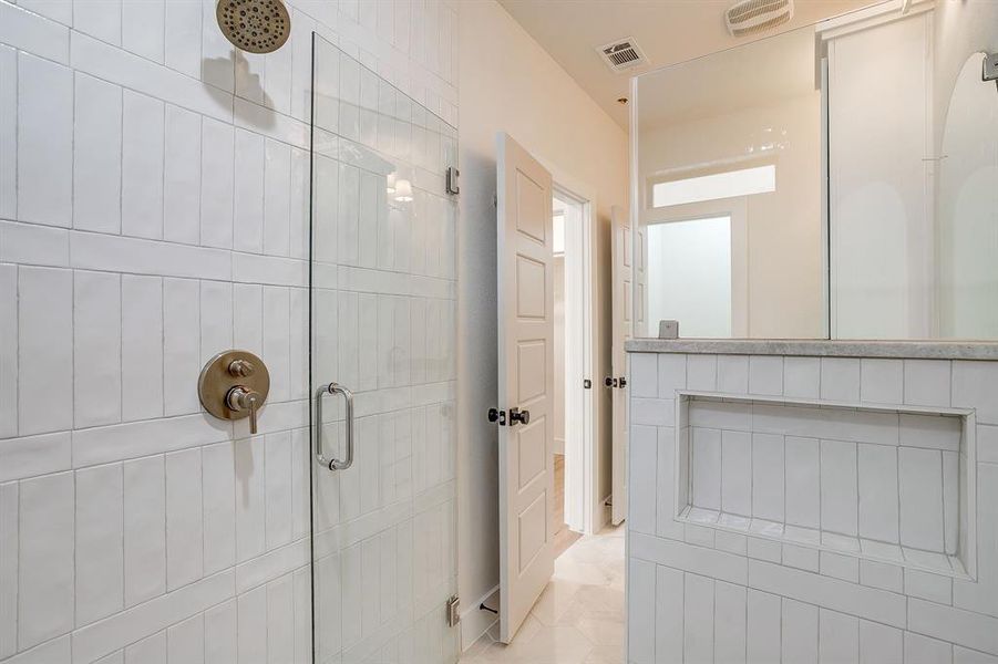 Walk-in shower oasis featuring designer tile and high-end finishes at Linwood Quarter. Walk-in shower oasis featuring designer tile and high-end finishes at Linwood Quarter.