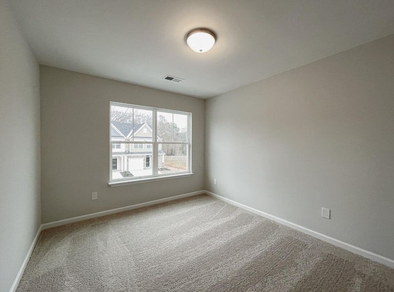 Spacious, unfurnished interior of a new home in East Main Townes, Spartanburg (Image 23).