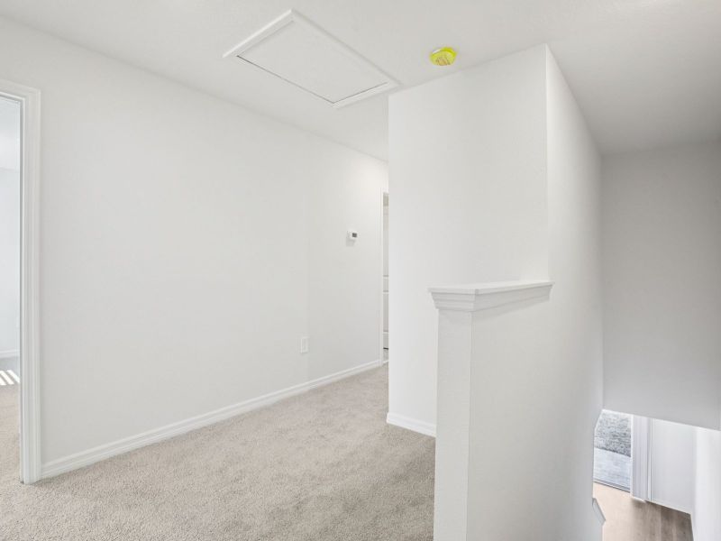 Spacious, unfurnished interior of a new home in The Reserve at Hammock Oaks Townes, Lady Lake (Image 9).