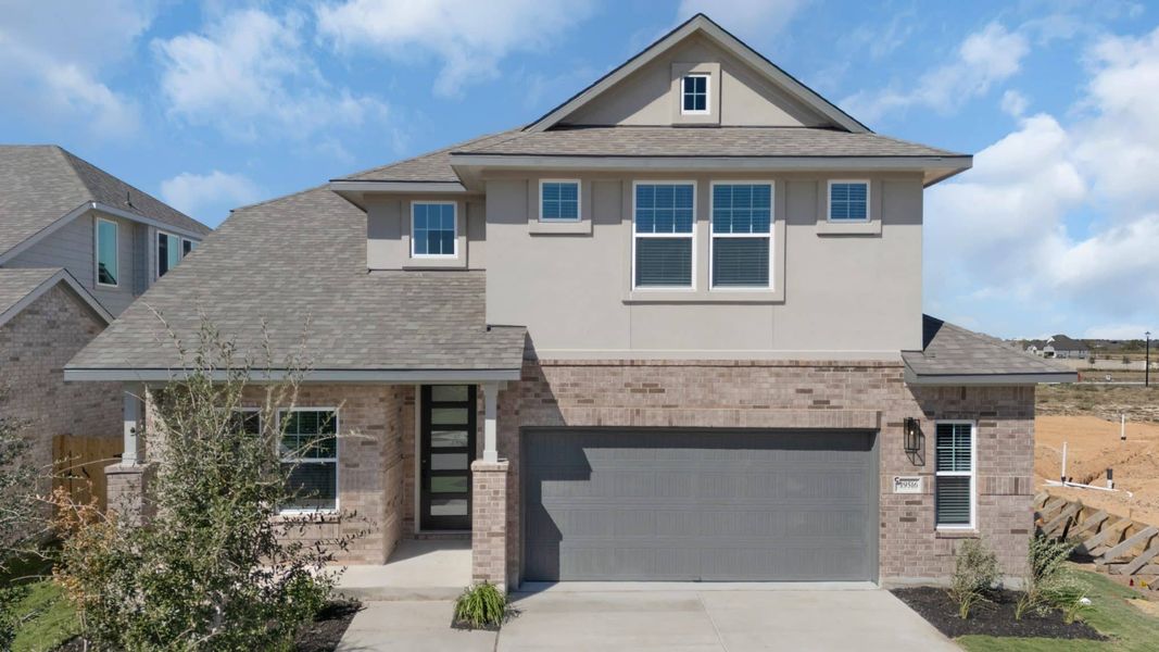 Front exterior of a new home in Lariat, Liberty Hill, TX, highlighting curb appeal (Image 27).