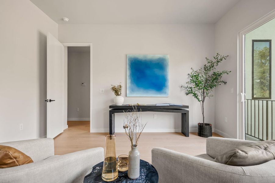 Smooth wood floors and sliding glass doors create a serene, light-filled atmosphere in this modern space. Smooth wood floors and sliding glass doors create a serene, light-filled atmosphere in this modern space.