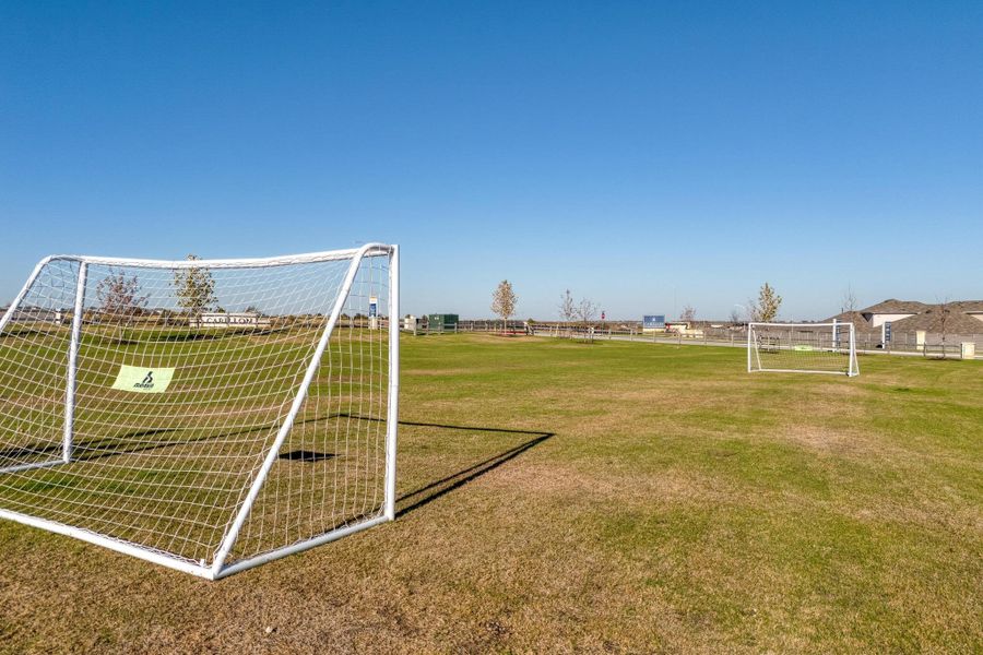 Get a game going or practice your footwork on the wide, open neighborhood soccer field with built-in goals ready for action Get a game going or practice your footwork on the wide, open neighborhood soccer field with built-in goals ready for action