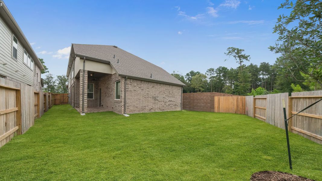 Exterior details and patio area of a home in Elyson 60's, Katy (Image 3).