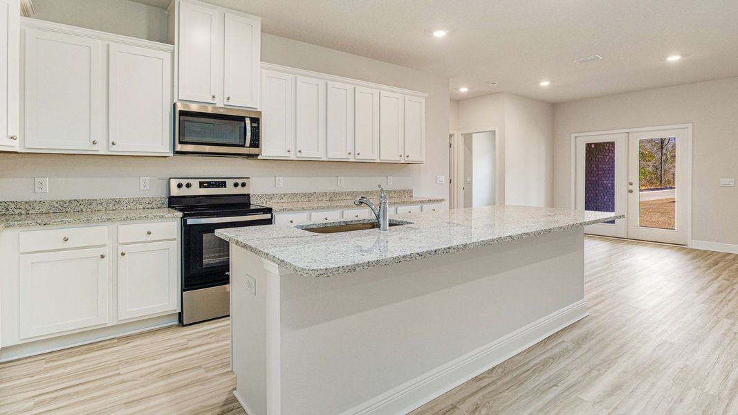 Representative furnished interior of a home built from the The Mckenzie by D.R. Horton in Greystone, Crawfordville (Image 3).