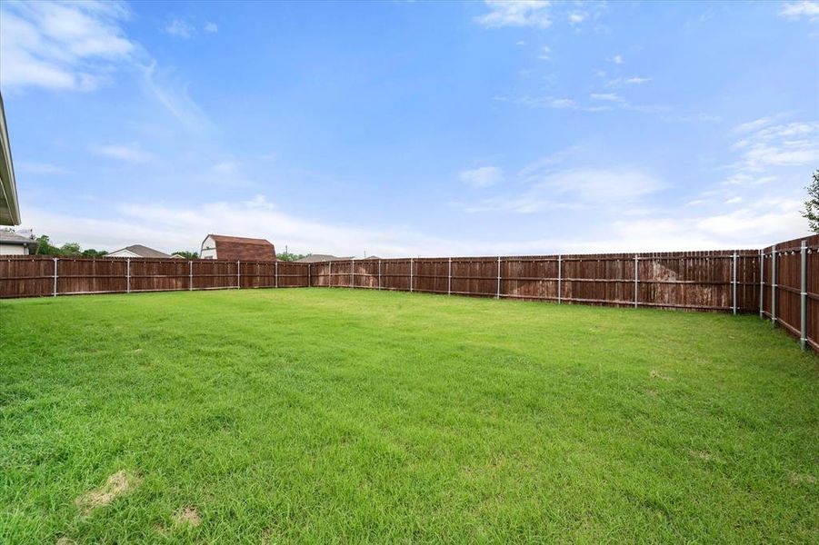 Exterior details and patio area of a home in Corsicana Commons, Corsicana (Image 23).