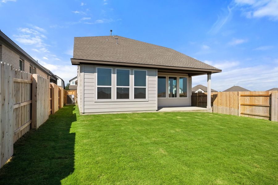 Exterior details and patio area of a home in Lariat, Liberty Hill (Image 29).