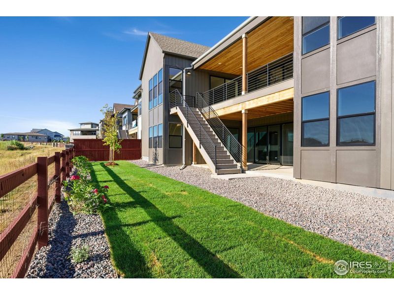 Exterior details and patio area of a home in The Fairways at RainDance, Windsor (Image 16).