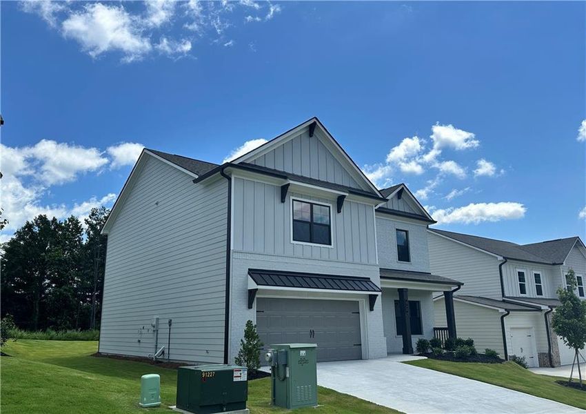 Front exterior of a new home in Summerlin, Winder, GA, highlighting curb appeal (Image 22).