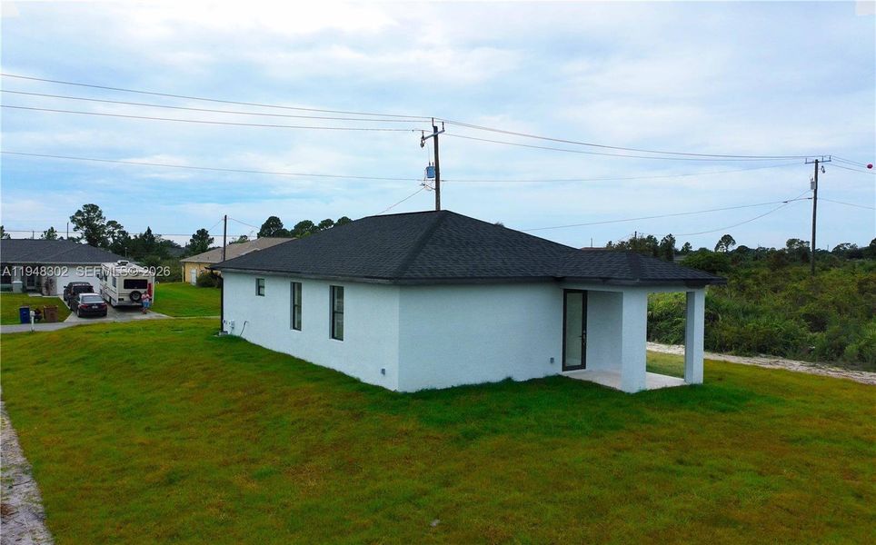 Exterior details and patio area of a home in , Lehigh Acres (Image 25).
