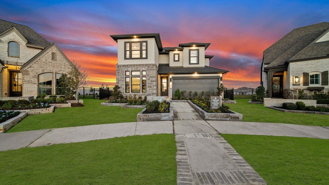Front exterior of a new home in Bridgeland 45', 50', 70', Cypress, TX, highlighting curb appeal (Image 2). Front exterior of a new home in Bridgeland 45', 50', 70', Cypress, TX, highlighting curb appeal (Image 2).