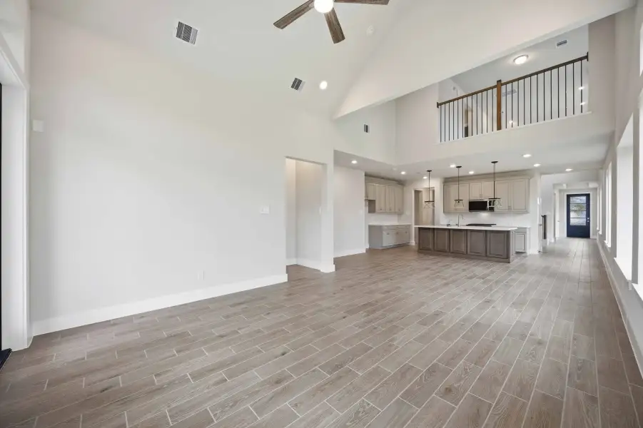 Spacious, unfurnished interior of a new home in Ellwood, Iowa Colony (Image 23).