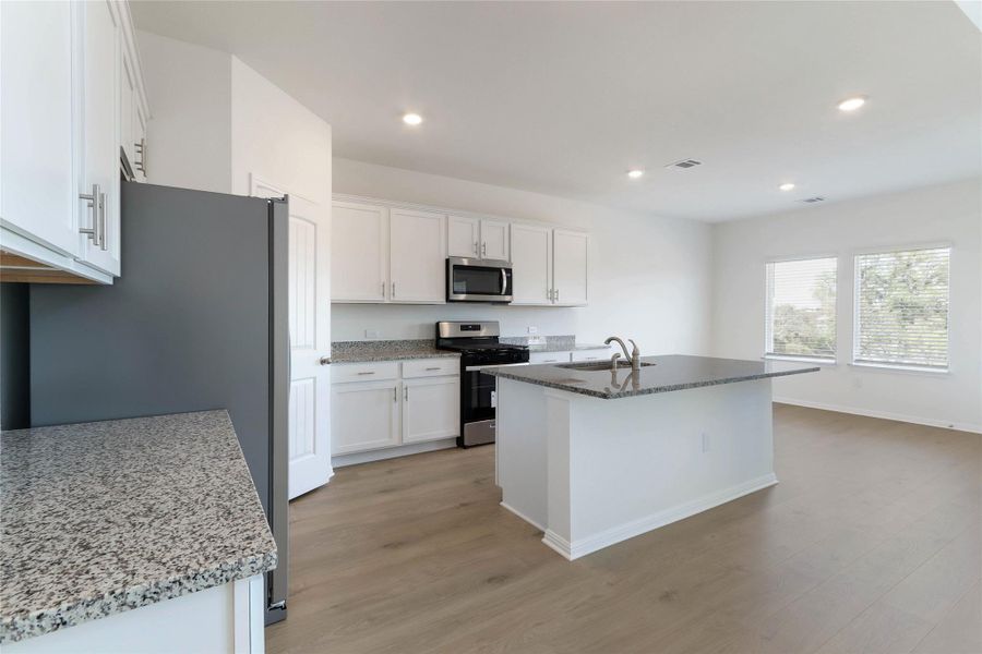 Furnished interior view inside a new home in Bar W Ranch, Leander (Image 9). Furnished interior view inside a new home in Bar W Ranch, Leander (Image 9).