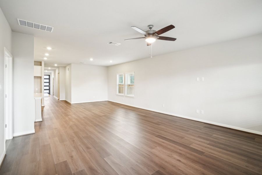 Living room and dining room of the Reynolds floorplan at a Meritage Homes community.