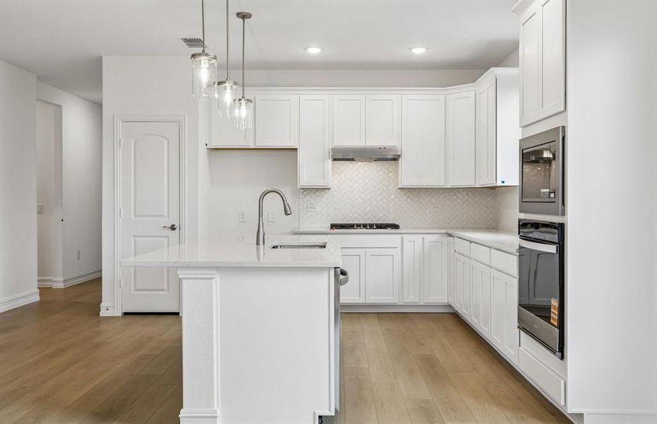 Beautiful kitchen with pendent lighting