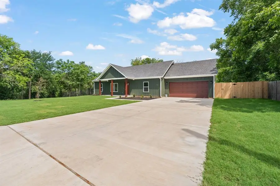 Front exterior of a new home in , Cleburne, TX, highlighting curb appeal (Image 20). Front exterior of a new home in , Cleburne, TX, highlighting curb appeal (Image 20).