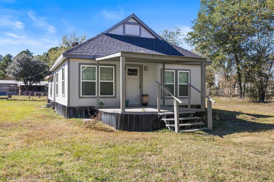 View of front of property featuring a shingled roof