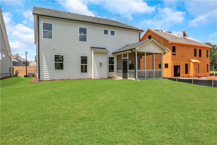 Front exterior of a new home in Twin Lakes, Hoschton, GA, highlighting curb appeal (Image 1). Front exterior of a new home in Twin Lakes, Hoschton, GA, highlighting curb appeal (Image 1).