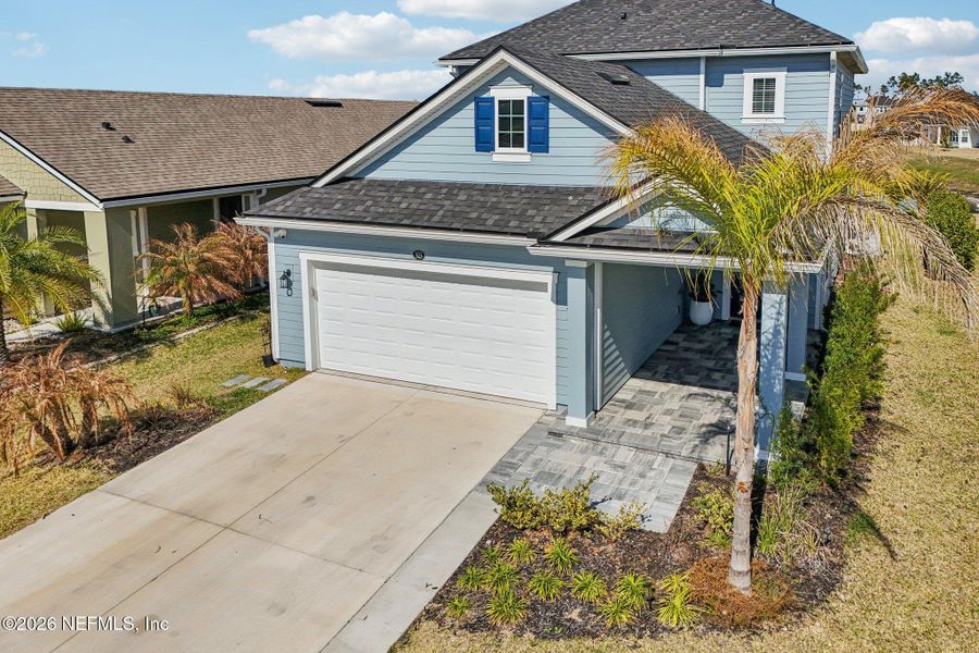 Front exterior of a new home in Beacon Lake, St. Augustine, FL, highlighting curb appeal (Image 28).