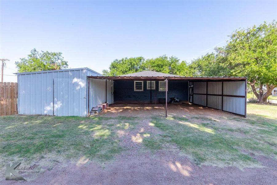 View of pole building with a carport