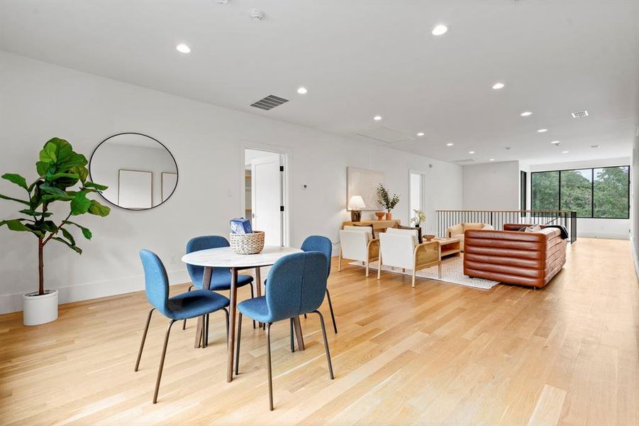 Dining area featuring light wood-type flooring and recessed lighting Dining area featuring light wood-type flooring and recessed lighting