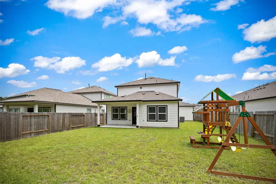 Front exterior of a new home in Liberty Collection at Fairway Farms, Tomball, TX, highlighting curb appeal (Image 2).