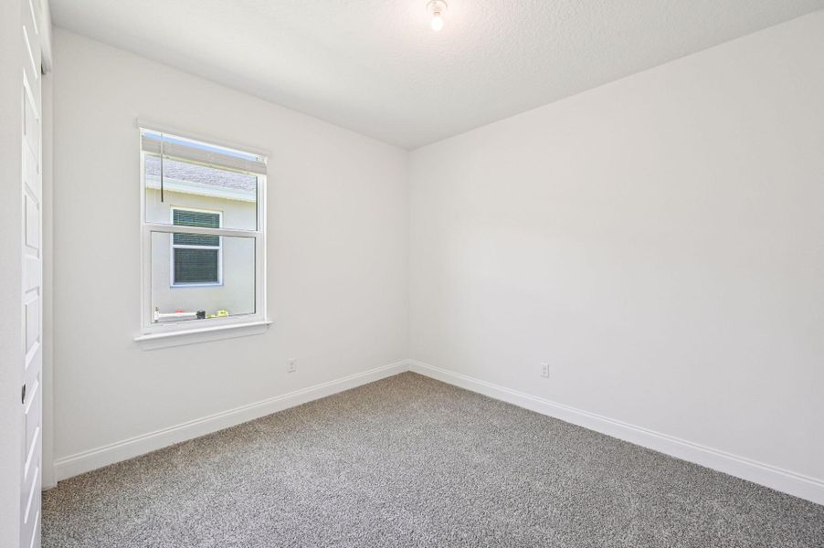 Spacious, unfurnished interior of a new home in Hampton Park - Signature Series, Vero Beach (Image 22).