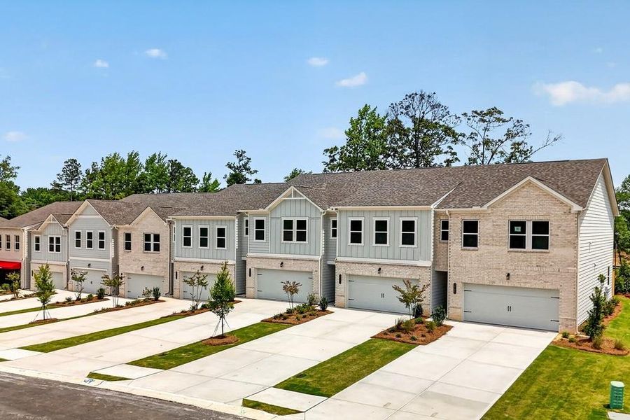 Front exterior of a new home in Weatherfield, Buford, GA, highlighting curb appeal (Image 23). Front exterior of a new home in Weatherfield, Buford, GA, highlighting curb appeal (Image 23).