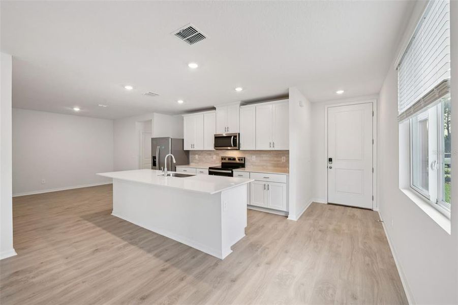 Furnished interior view inside a new home in Ridgehaven - Villas, Ormond Beach (Image 8).