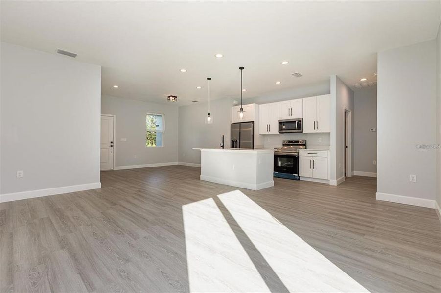 Spacious, unfurnished interior of a new home in , Port Charlotte (Image 21).