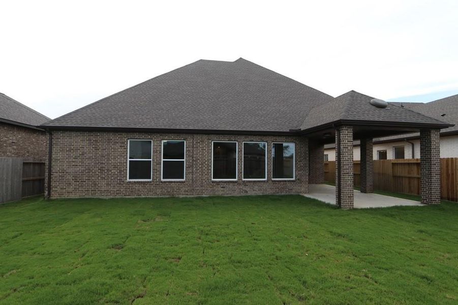 Front exterior of a new home in Riceland 60’ Homesites, Mont Belvieu, TX, highlighting curb appeal (Image 2).