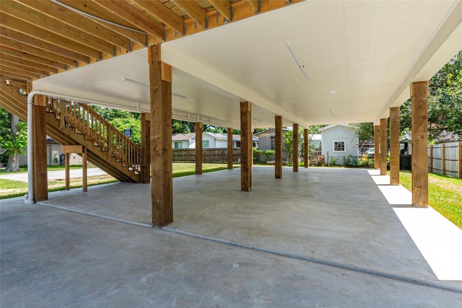 Plenty of space for additional covered parking and outdoor furniture under the home on the concrete slab.