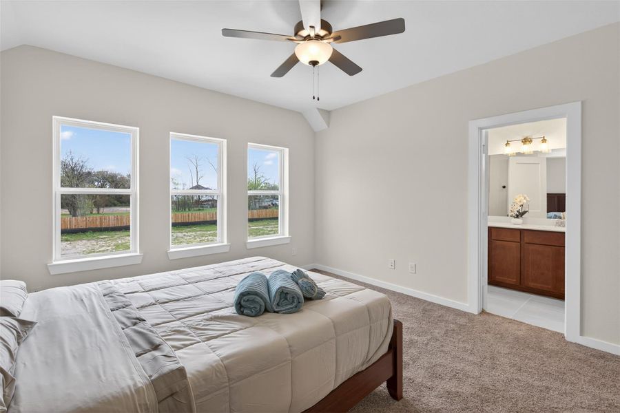 Beautifully appointed primary bedroom with large windows and direct access to the ensuite bath, offering comfort, privacy, and a refined living experience. Beautifully appointed primary bedroom with large windows and direct access to the ensuite bath, offering comfort, privacy, and a refined living experience.