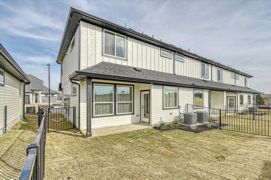 Exterior details and patio area of a home in Townhomes at Gattis, Round Rock (Image 4). Exterior details and patio area of a home in Townhomes at Gattis, Round Rock (Image 4).