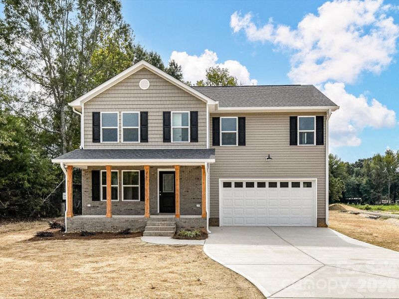 Front exterior of a new home in , Marshville, NC, highlighting curb appeal (Image 1). Front exterior of a new home in , Marshville, NC, highlighting curb appeal (Image 1).