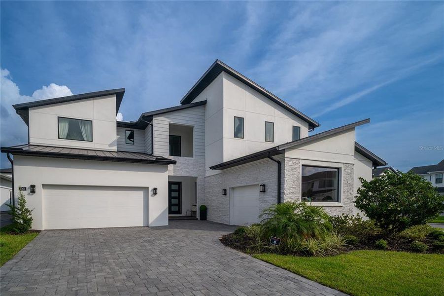 Front exterior of a new home in , Orlando, FL, highlighting curb appeal (Image 13).