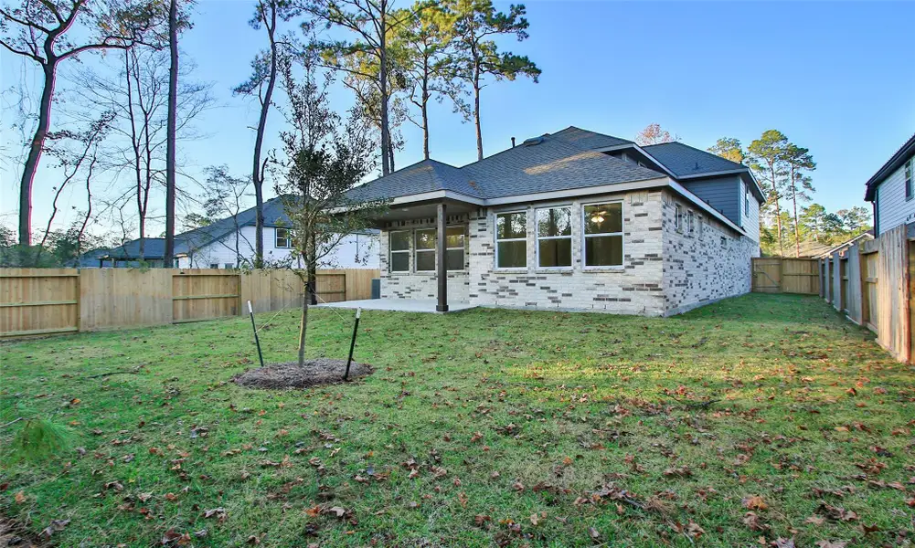 Exterior details and patio area of a home in The Woodlands Hills, Willis (Image 3). Exterior details and patio area of a home in The Woodlands Hills, Willis (Image 3).