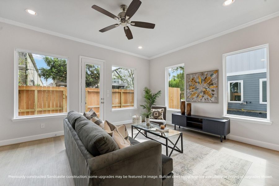 Living Room with Natural Light – Tall ceilings, recessed lighting, and oversized windows make this living space bright, airy, and perfect for relaxation.