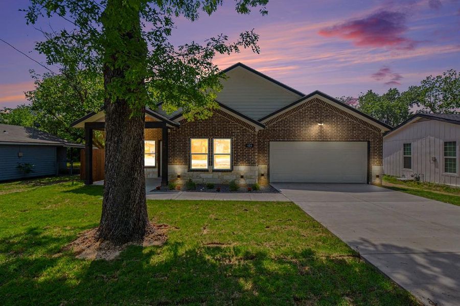 The property features a brick and siding exterior with a stone accent facade
