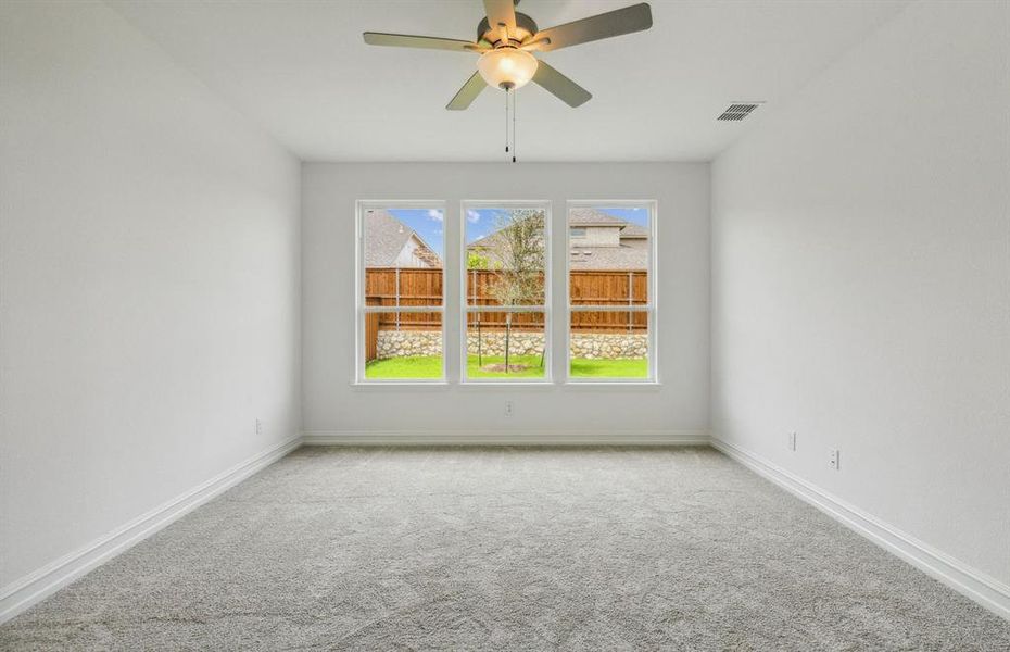 Owner's suite with large windows *real home pictured