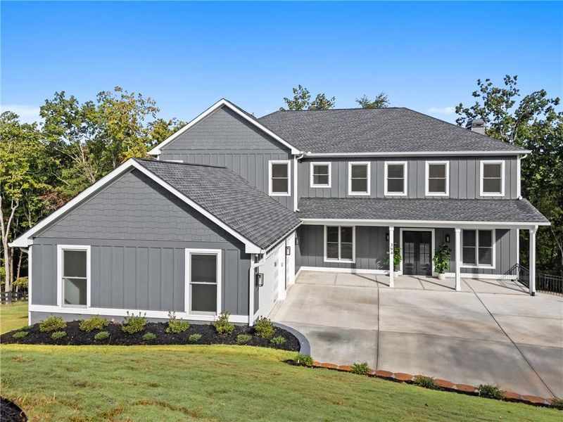 Front exterior of a new home in , Ball Ground, GA, highlighting curb appeal (Image 1).