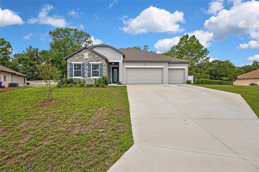Front exterior of a new home in , Homosassa, FL, highlighting curb appeal (Image 23). Front exterior of a new home in , Homosassa, FL, highlighting curb appeal (Image 23).